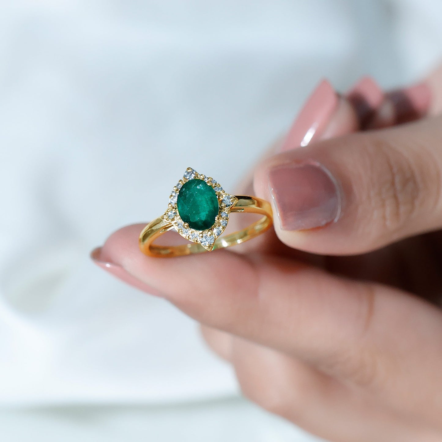 Vintage Looking Emerald Oval Engagement Ring with Diamond Halo