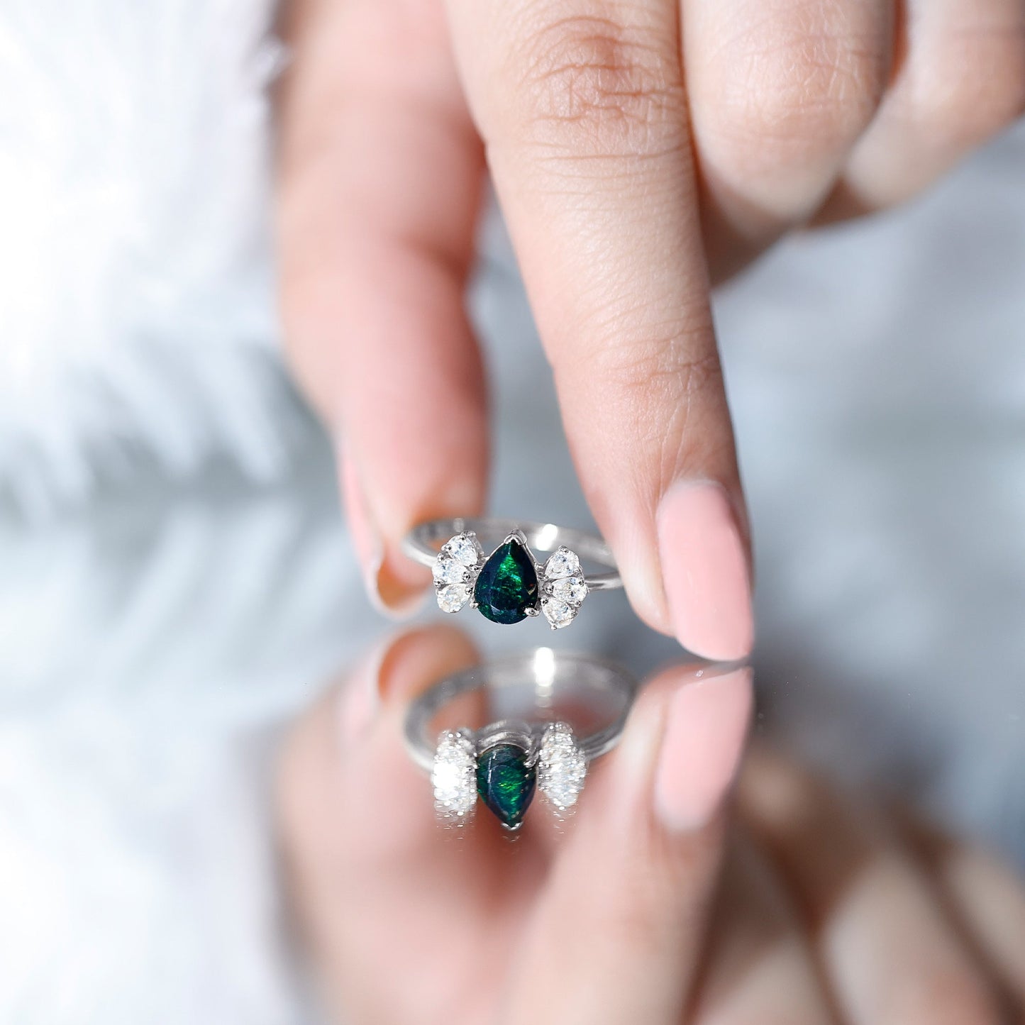 Pear Cut Black Opal Solitaire Engagement Ring with Diamond Trio