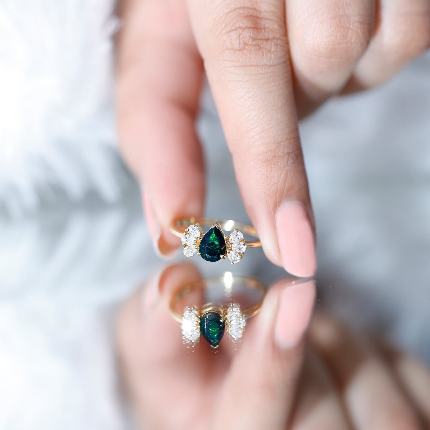 Pear Cut Black Opal Solitaire Engagement Ring with Diamond Trio