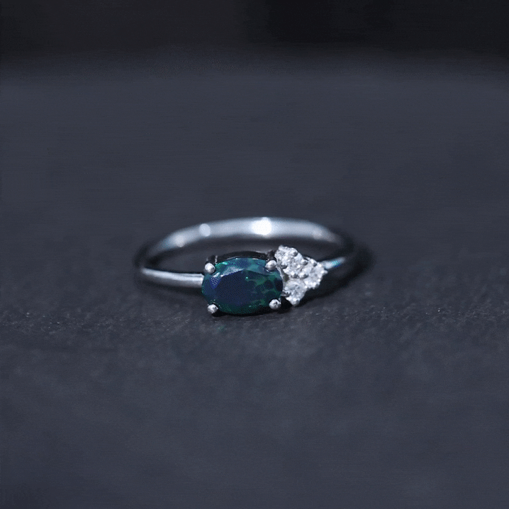 Oval Black Opal East West Ring with Diamond Trio