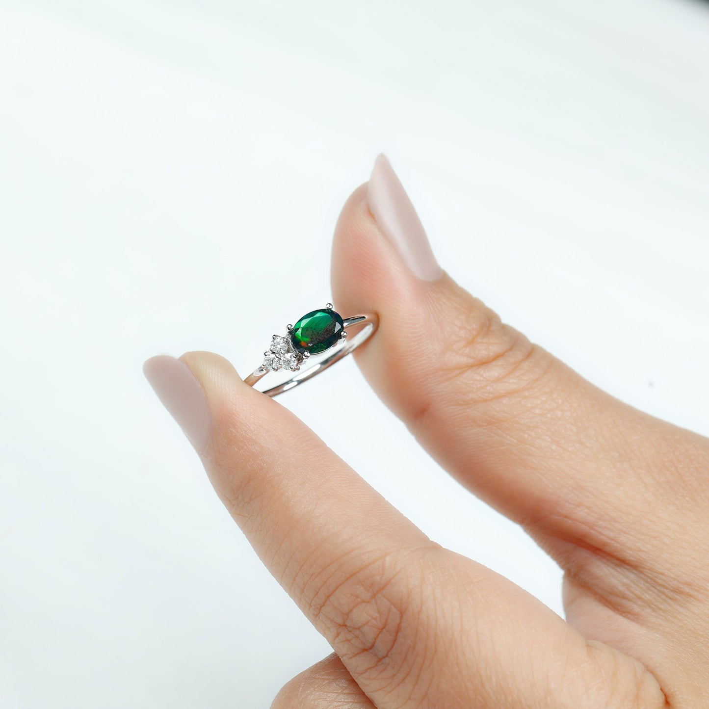 Oval Black Opal East West Ring with Diamond Trio