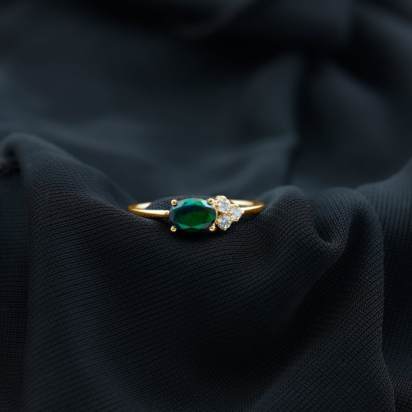 Oval Black Opal East West Ring with Diamond Trio