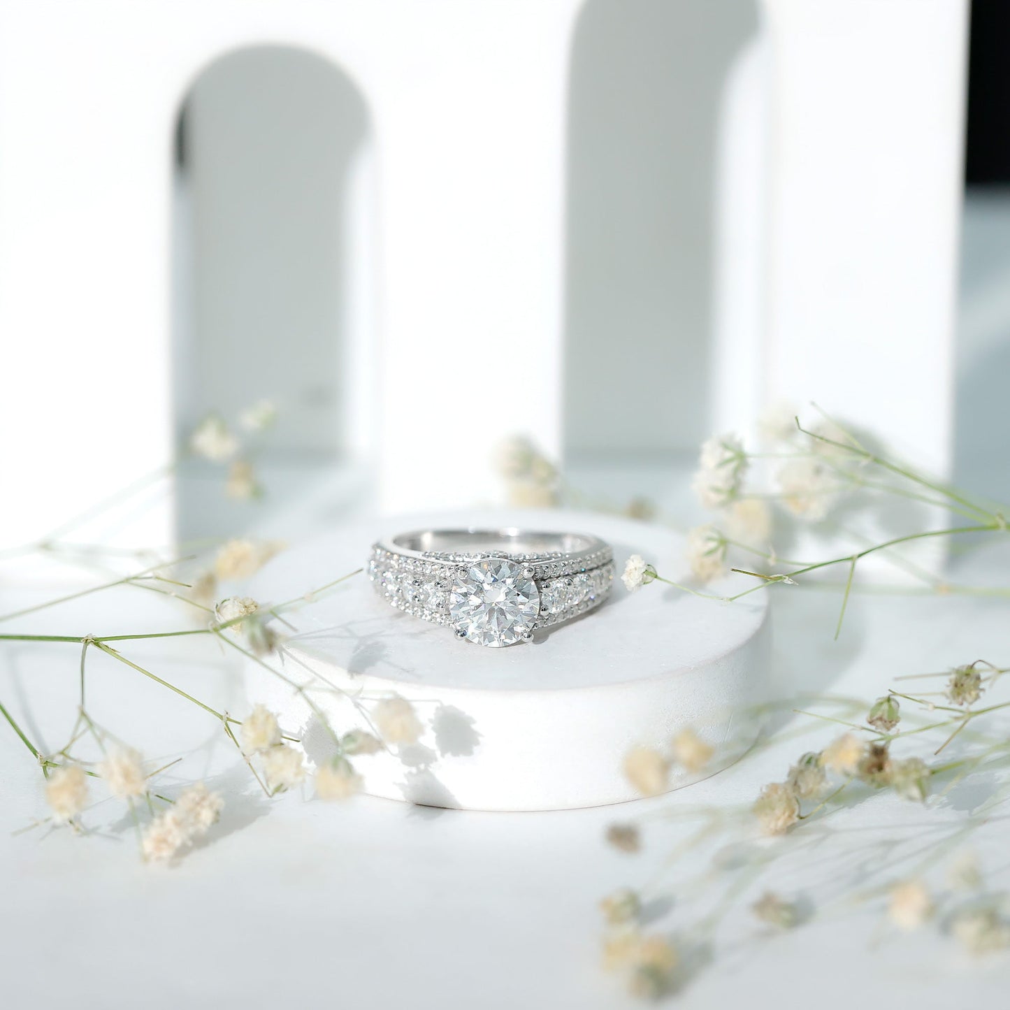 Round Brilliant Cut Moissanite Side Stone Engagement Ring