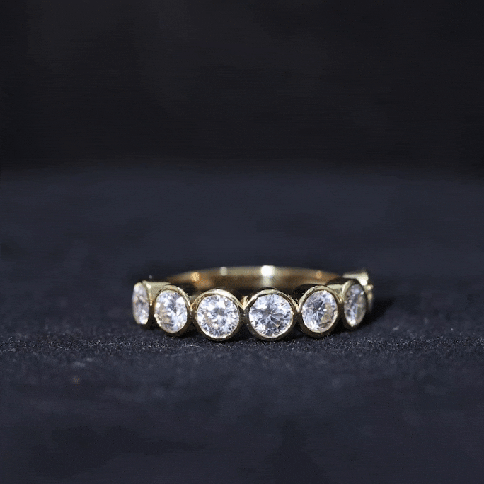 Round Moissanite Half Eternity Ring in Bezel Setting