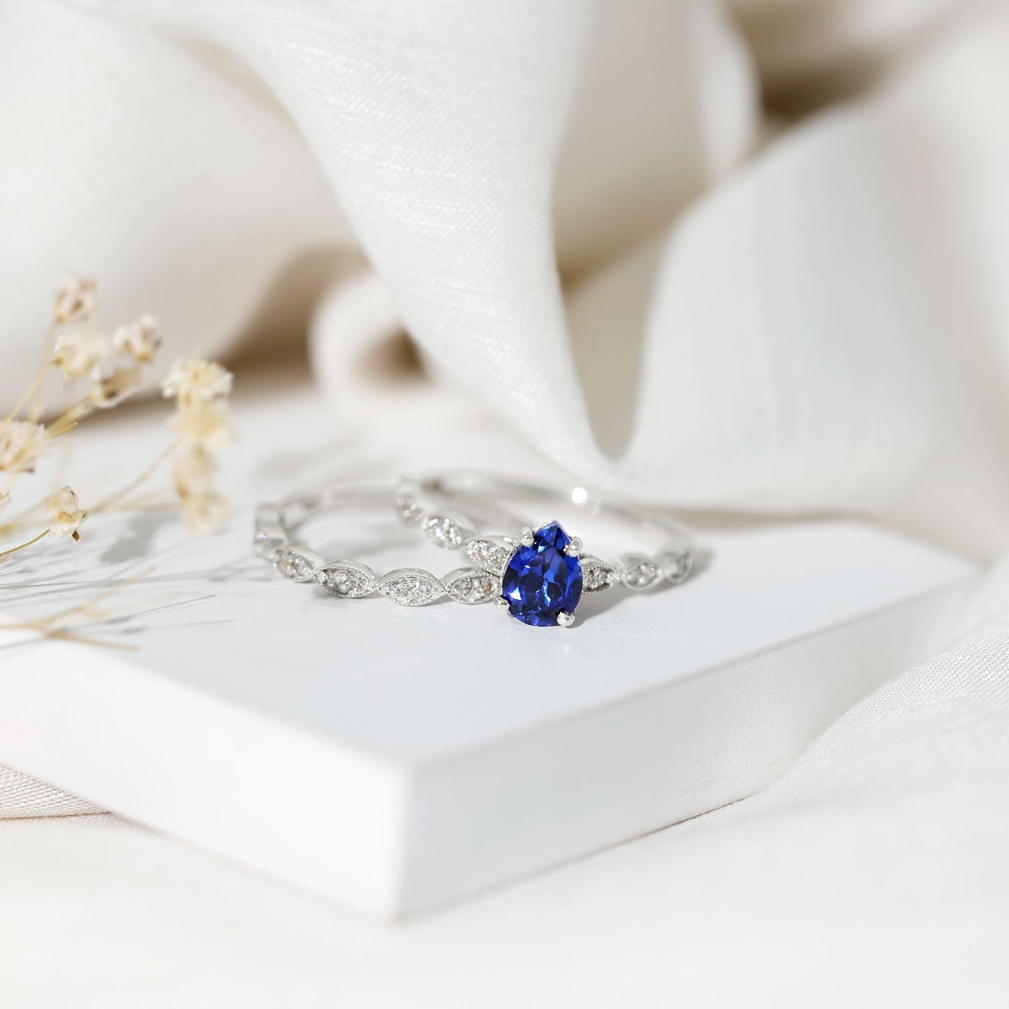 1.6 Carat Pear Lab Grown Blue Sapphire Engagement Ring with Diamond Band