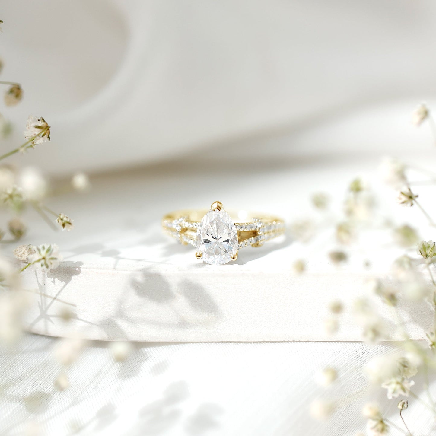 Pear Shaped Moissanite Solitaire Engagement Ring in Split Shank