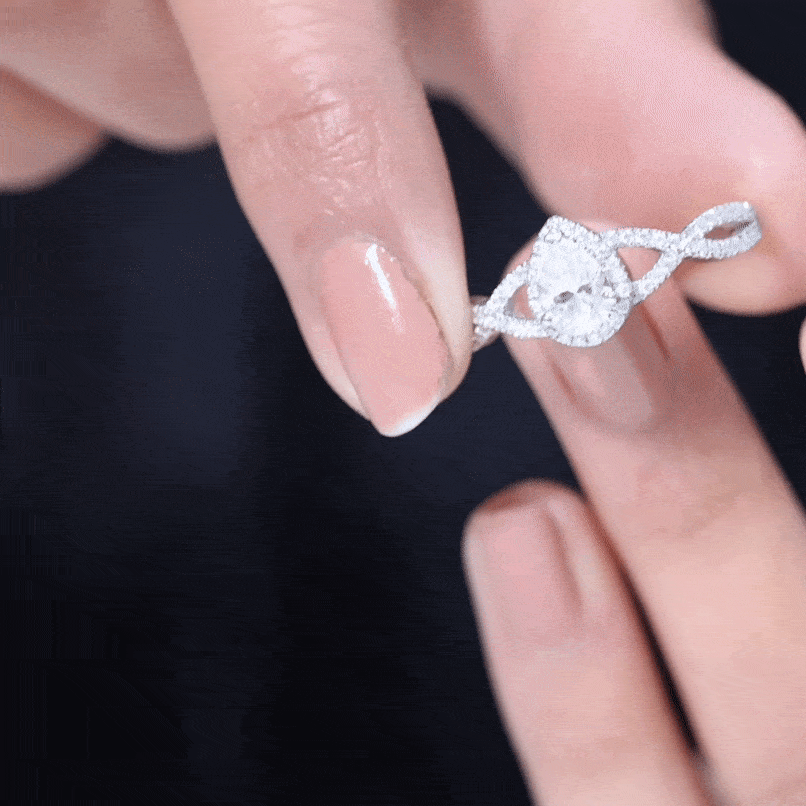 Pear Shaped Moissanite Crossover Engagement Ring with Halo