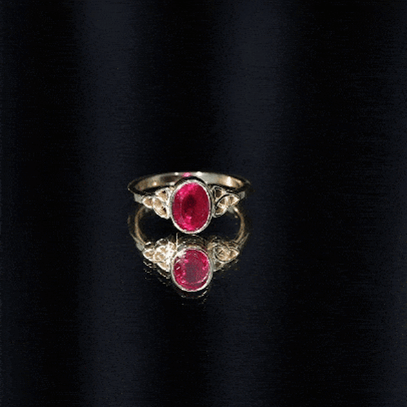 Oval Shaped 1.5 Carat Lab Grown Ruby Celtic Engagement Ring in Bezel Setting