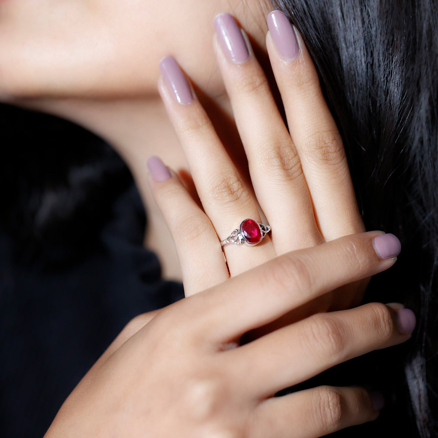Oval Shaped 1.5 Carat Lab Grown Ruby Celtic Engagement Ring in Bezel Setting