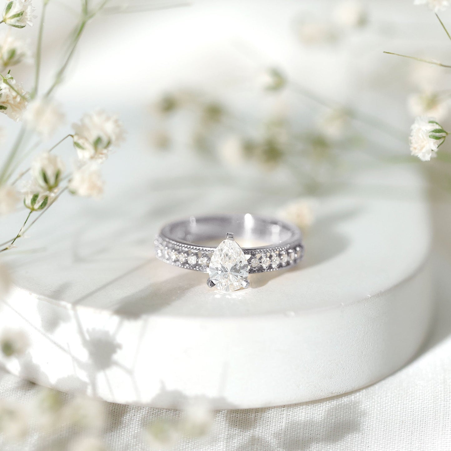 Pear Shaped Moissanite Solitaire Engagement Ring with Beaded Design