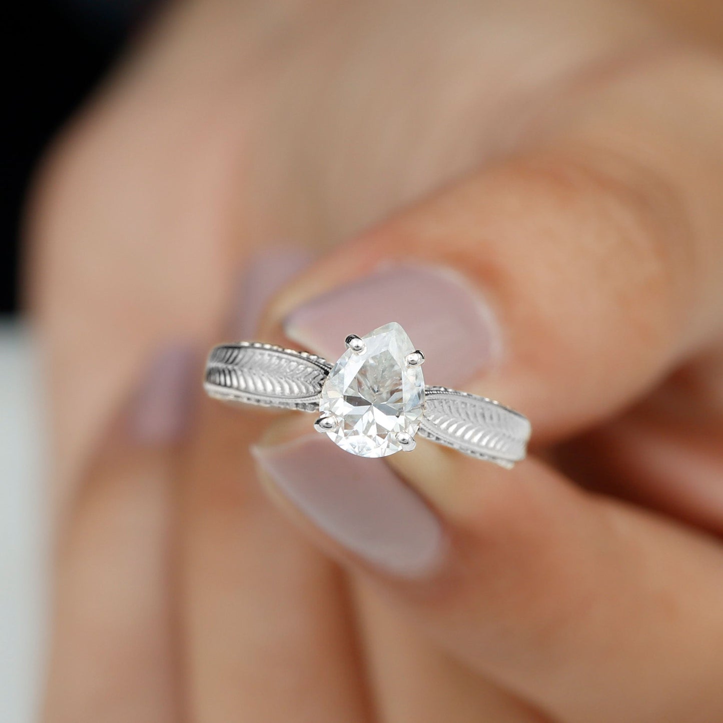 Claw Set Pear Shape Moissanite Engagement Ring