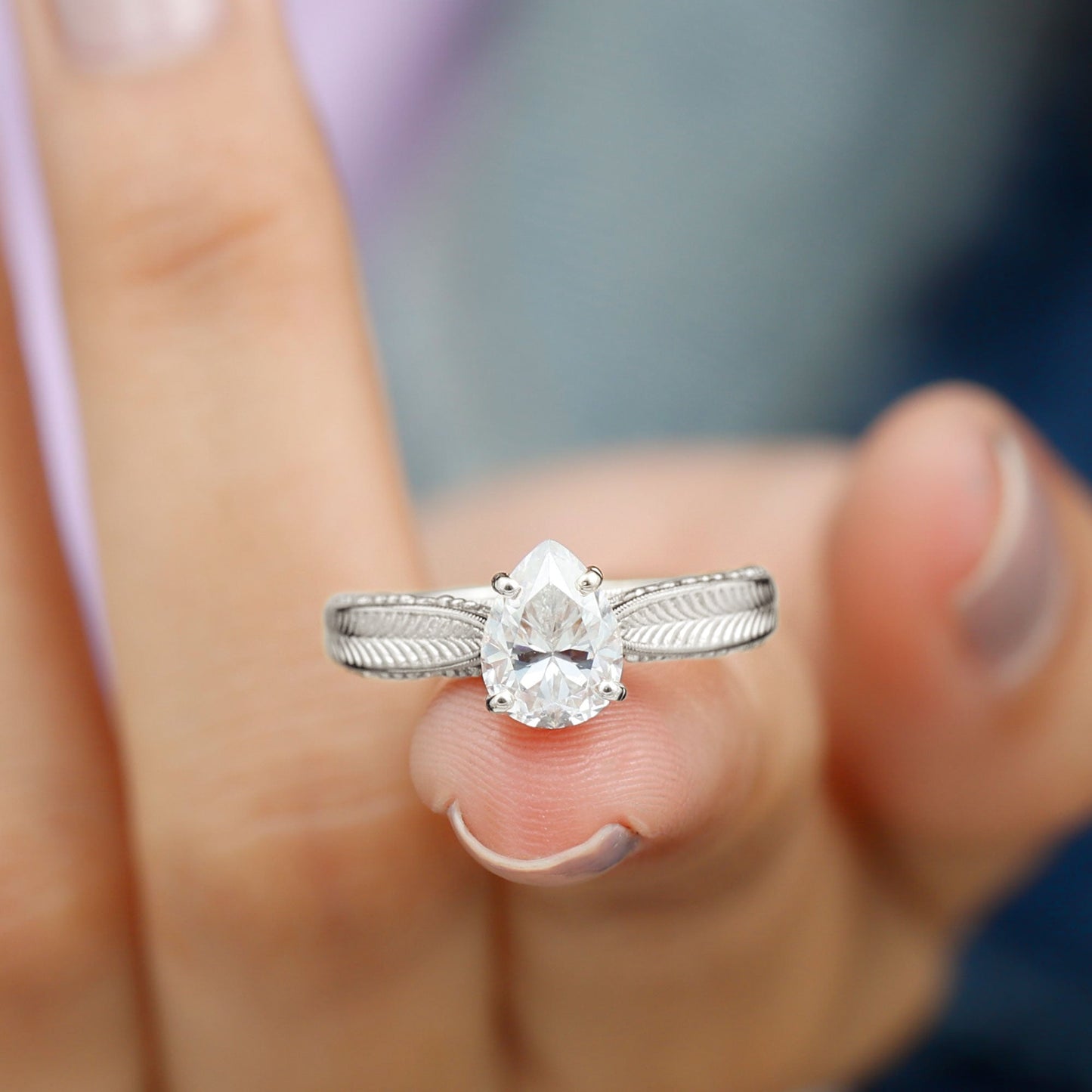 Claw Set Pear Shape Moissanite Engagement Ring
