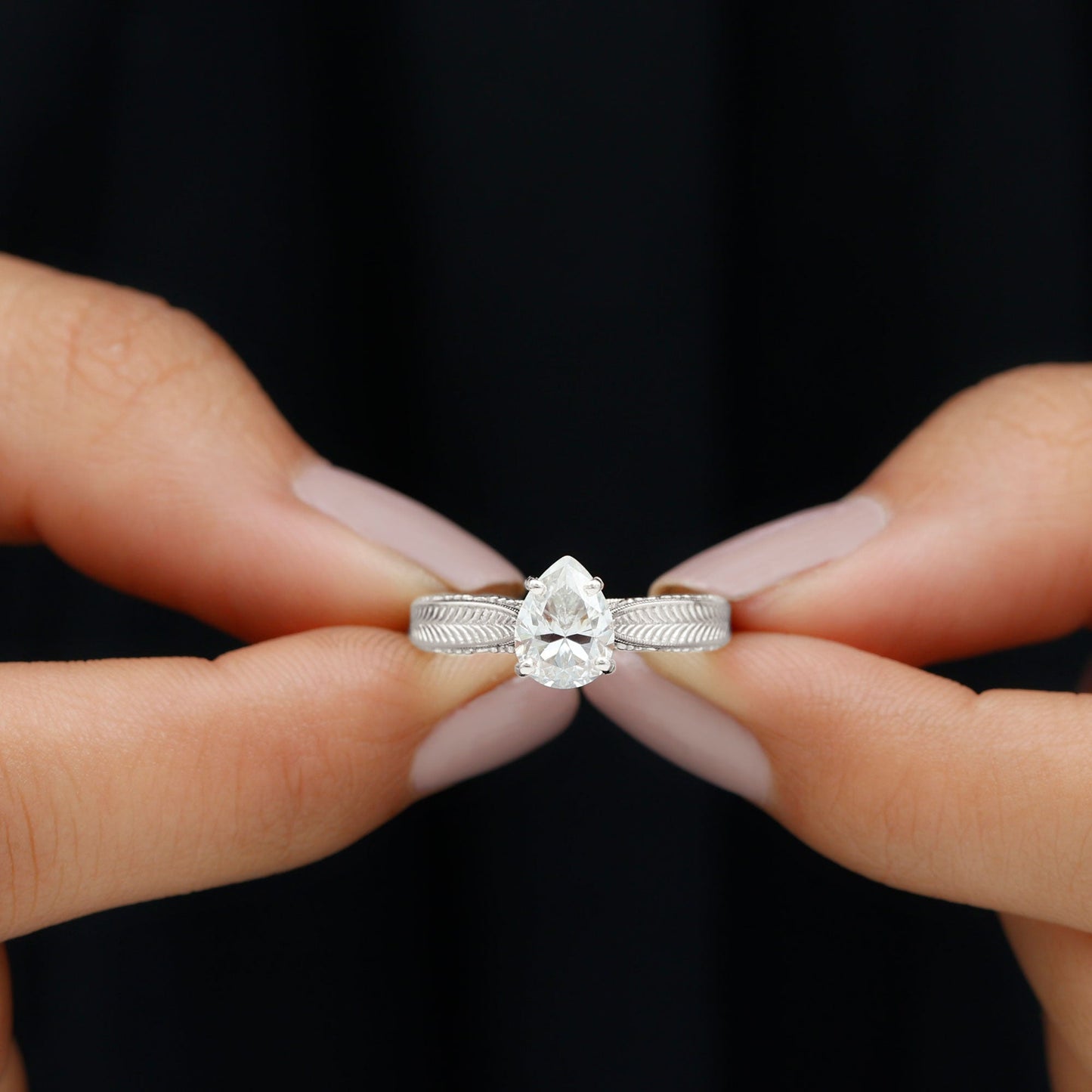 Claw Set Pear Shape Moissanite Engagement Ring