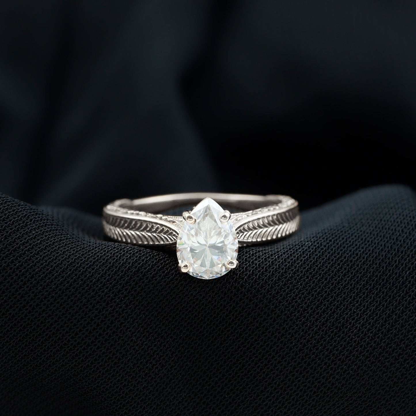 Claw Set Pear Shape Moissanite Engagement Ring