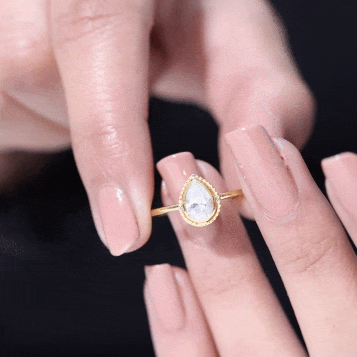 Pear Shaped Moissanite Solitaire Engagement Ring in Bezel Setting