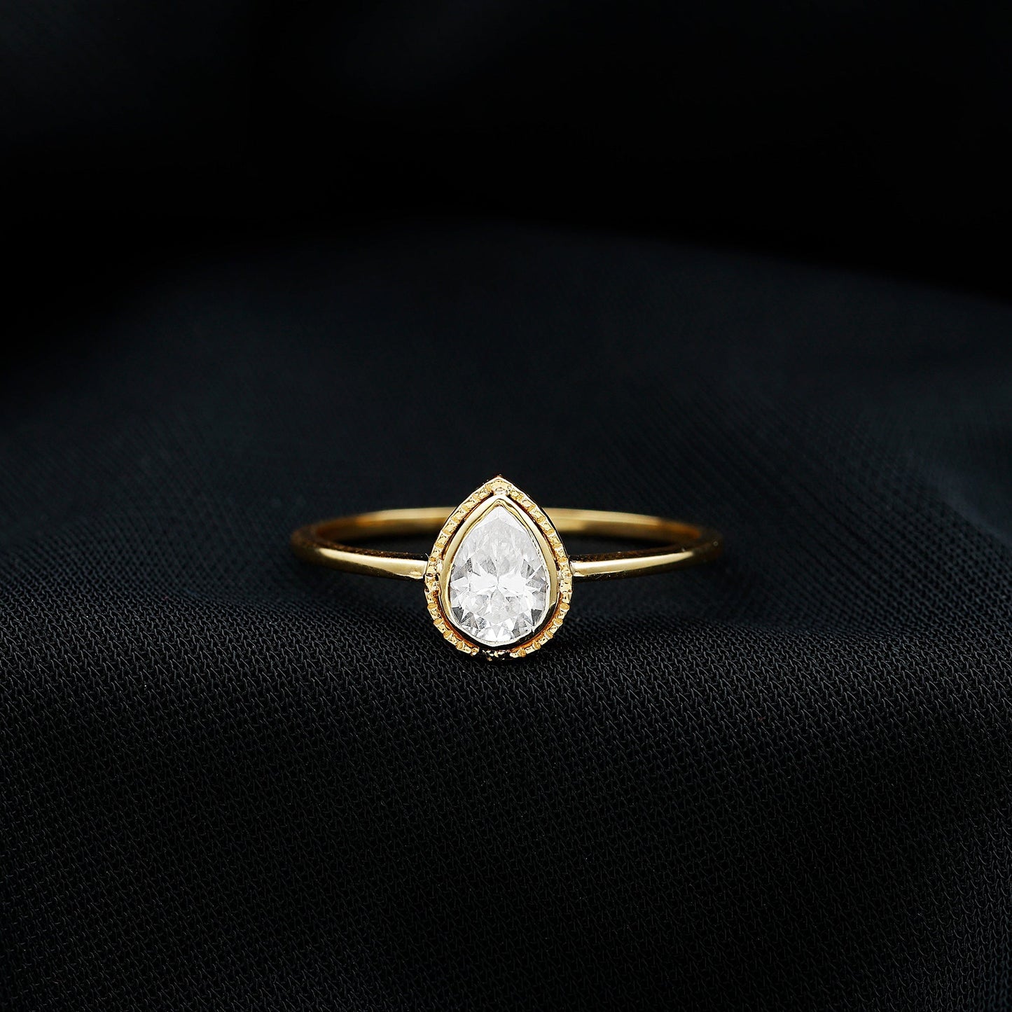 Pear Shaped Moissanite Solitaire Engagement Ring in Bezel Setting